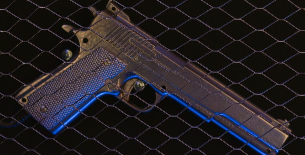 Pistol on a Black Surface